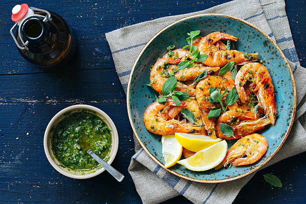 Prawns with chimichurri King prawns with chimichurri prawn seafood photos stock pictures, royalty-free photos & images