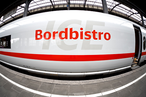Wiesbaden, Germany - August 14, 2011: Description on a cabin of a waiting ICE train at main station Wiesbaden, Germany. Bordbistro means: buffet or dining car which is a railroad passenger car that serves meals in a sit-down restaurant. ICE, formerly known as InterCityExpress is a highspeed train system in Germany. Deutsche Bahn AG (DB) is a national railway company in Germany and headquartered in Berlin. DB is the successor to the former state railways of Germany (Deutsche Bundesbahn). Fish-eye lens