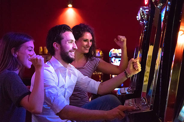 istock Friends Playing The Slots 474167234