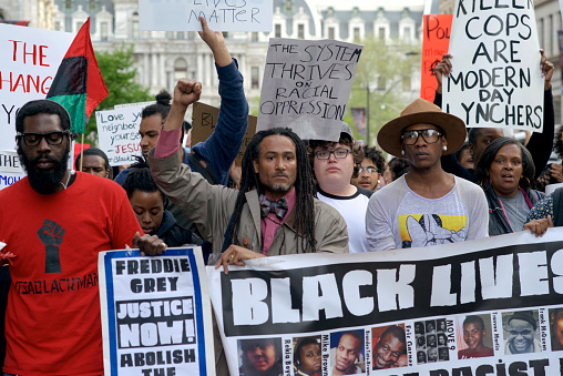 Philadelphia, PA, USA - April 30, 2015; Protestors in support of the national 'Black Lives Matter' movement gathered at Dillworth Plaza in Philadelphia on April 30 are here seen leaving the Center City square as they march North on Broad Street. Joined in the from row are protestors carrieng 'Free Mumia' banners. (photo by Bastiaan Slabbers)