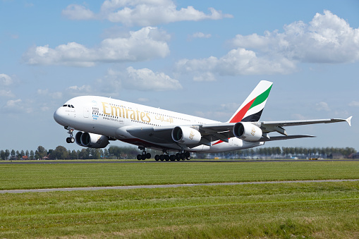 Amsterdam, The Netherlands - May 13, 2015: An Airbus A380-861 of Emirates takes off at Amsterdam Airport Schiphol (The Netherlands, AMS) on May 13, 2015. The name of the runway is Polderbaan.