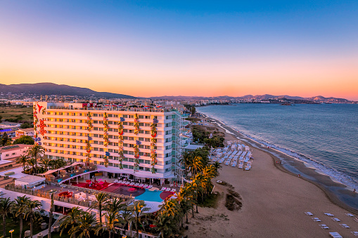 Ibiza, Spain - July 4, 2014: Ushuaia Hotel on Playa d'en Bossa Beach in Ibiza. Famous hotel during sunset.