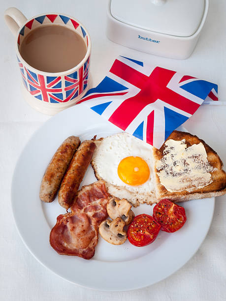 istock Bacon and eggs with  british flag, tea, butter dish 474169659