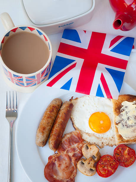 istock English Breakfast with tea toast and british flag 474170213