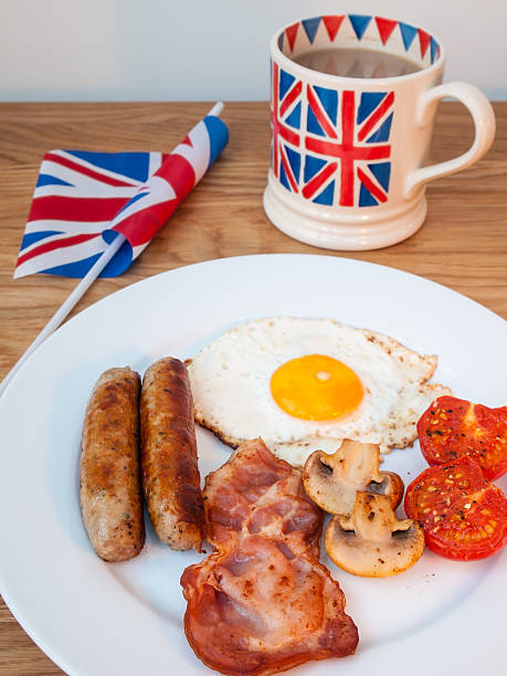 istock Bacon and eggs with cup of tea british flag  close-up 474175367