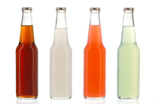 Four assorted soda bottles, alcoholic drinks