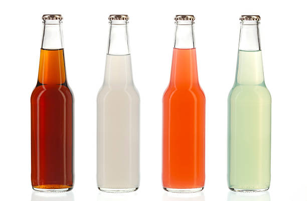 Four assorted soda bottles, alcoholic drinks stock photo