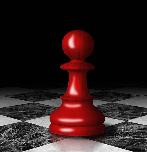 istock Red chess pawn on the marble chessboard. 474177995