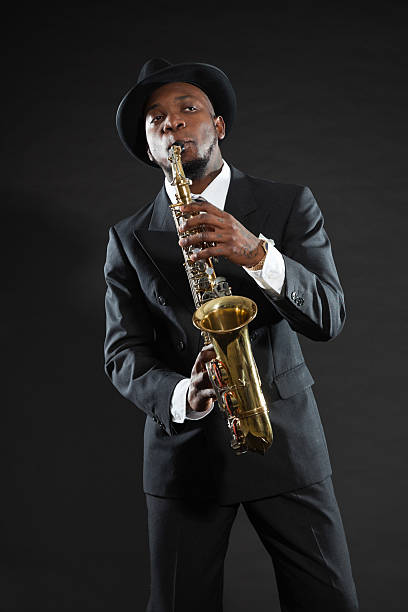 istock Black american jazz saxophone player. Vintage. Studio shot. 474178577