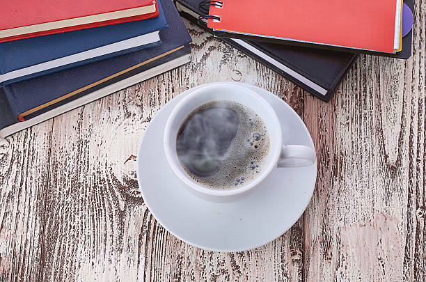 istock Cup of coffee on a wooden table 474179559