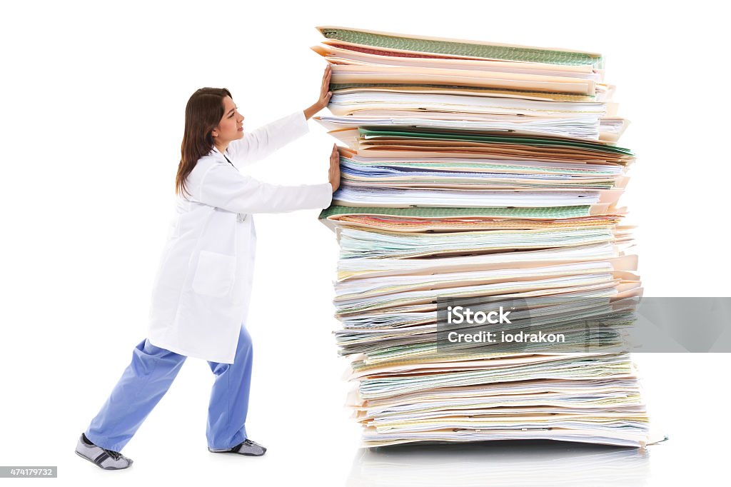 Paper pusher Stock image of a female healthcare worker pushing a giant stack of papers isolated on white background Doctor Stock Photo