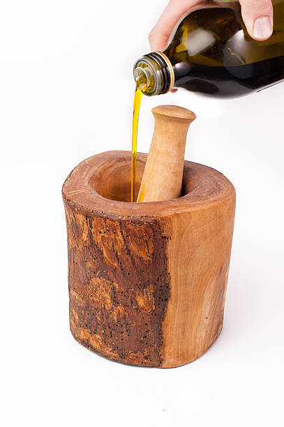 istock Pouring olive oil into pestle and mortar 474183152