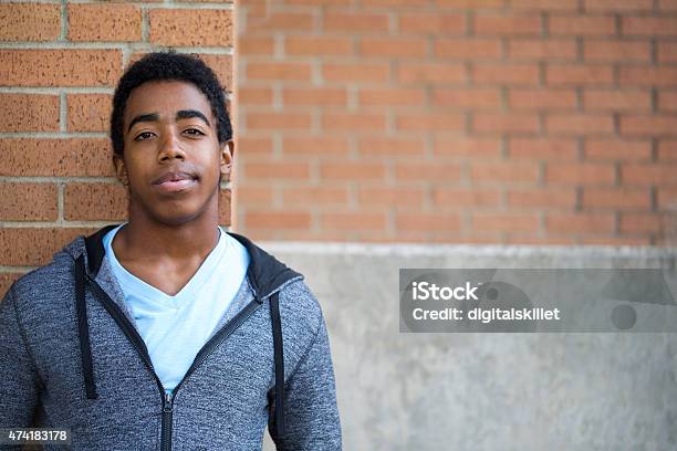 African American Teenager Looking To The Future Stock Photo - Download Image Now - Teenager, Adolescence, Serious