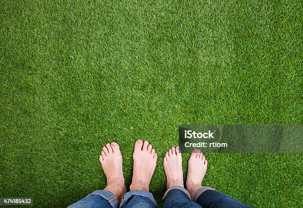 Men And Woman Legs Standing Together On Grass Stock Photo - Download Image Now - Grass, Barefoot, Lawn
