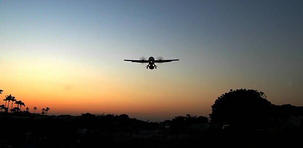 istock Airplan take off in the tropical sunset scence 474185851