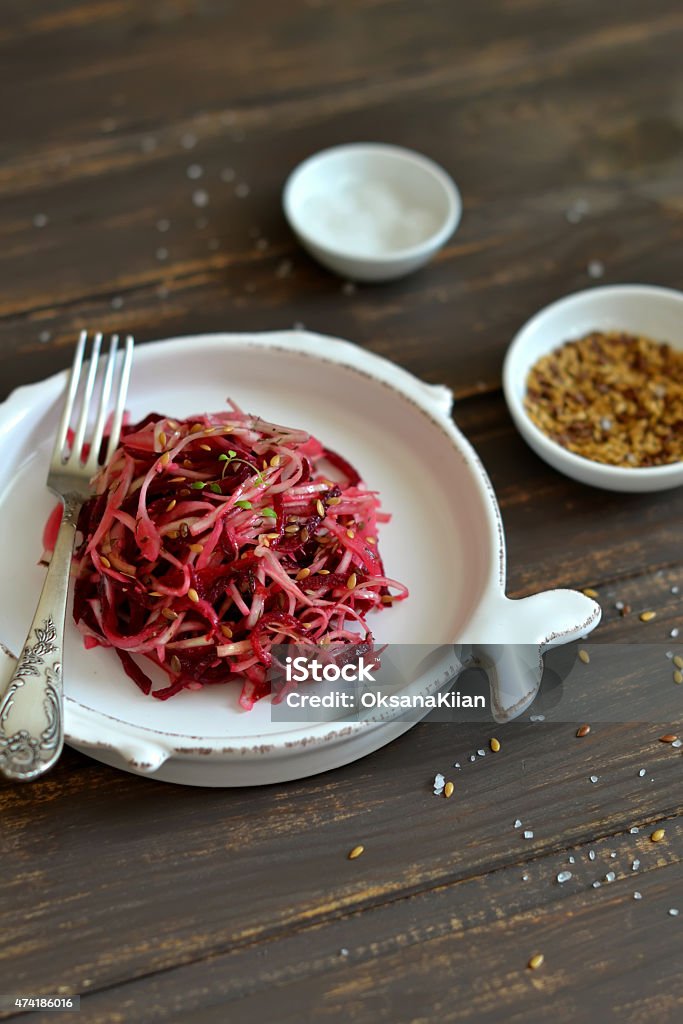 fresh salad with cabbage and beets fresh salad with cabbage and beets in a vintage plate on a dark wooden surface 2015 Stock Photo