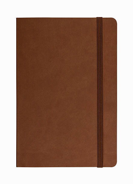 brown leather notebook isolated on white background brown leather notebook isolated on white background moleskin stock pictures, royalty-free photos & images