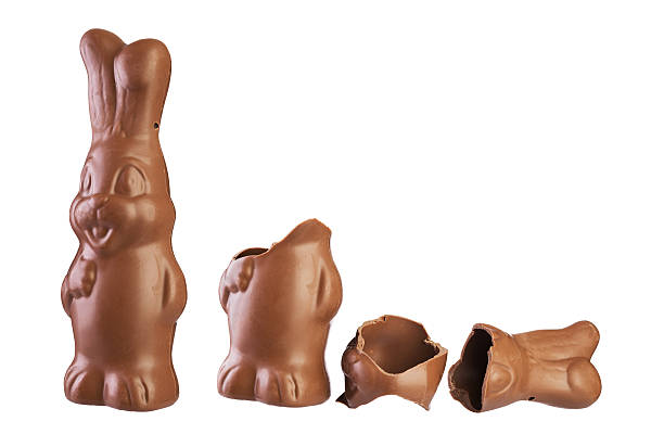 easter chocolate bunny easter chocolate bunny whole and divided into pieces isolated on white chocolate bunny stock pictures, royalty-free photos & images
