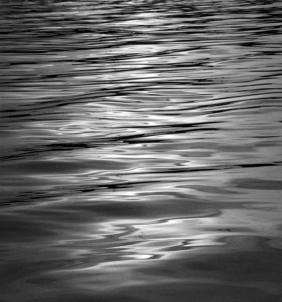 istock White and black shimmering Seawater Background 474187110