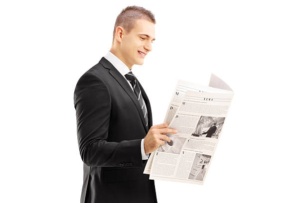 istock Young businessman reading a newspaper 474189755