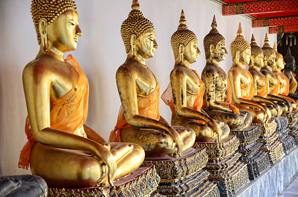 istock Statues of Buddha in row. 474190476