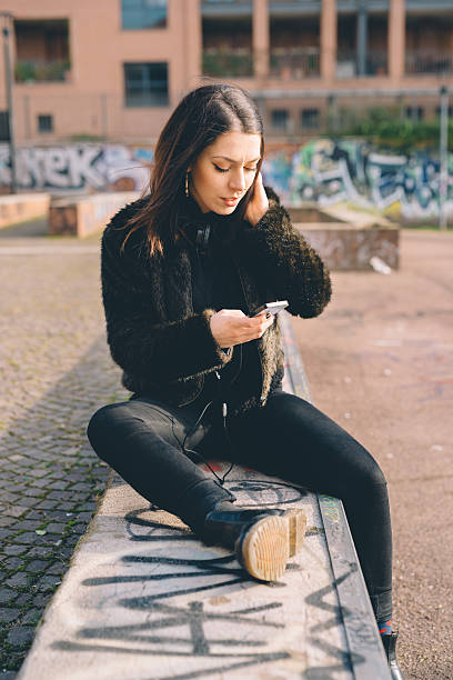 istock young beautiful woman usin smartphone 474192566