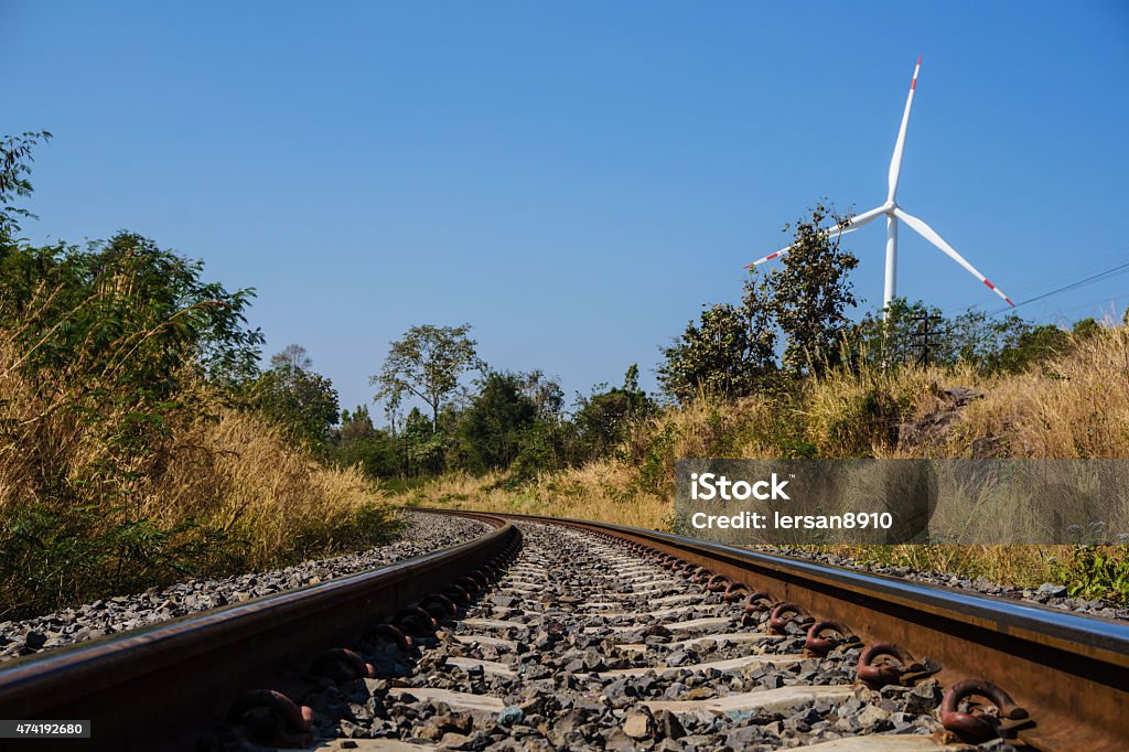 railroad and wind turbine railroad for transport and wind turbine for electric power 2015 Stock Photo