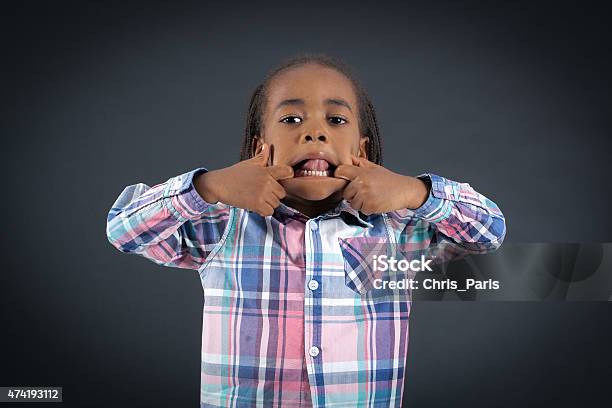 Handsome Boy Doing Different Expressions In Different Sets Of Clothes Stock Photo - Download Image Now