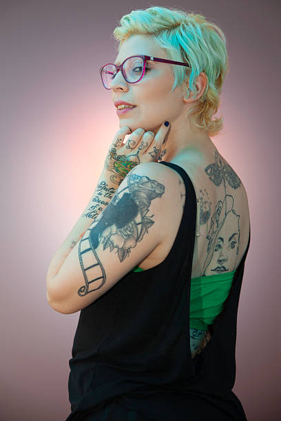istock Girl with tattoos in a colored frame 474193204