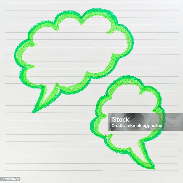 Sketch Of Green Speech Bubble On The Lined Paper Stock Photo - Download Image Now - 2015, Abstract, Art