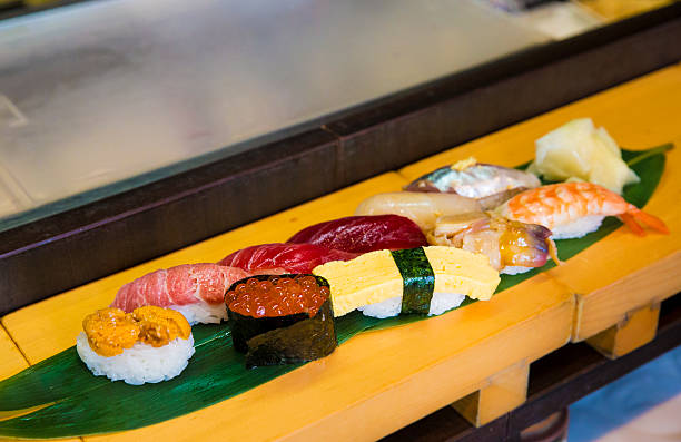 istock Sushi and sashimi on a leaf at market stall 474194342