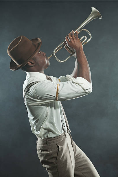 Black african american jazz trumpet player. Vintage. Studio shot. Black african american jazz trumpet player. Vintage. Studio shot. man trumpet stock pictures, royalty-free photos & images