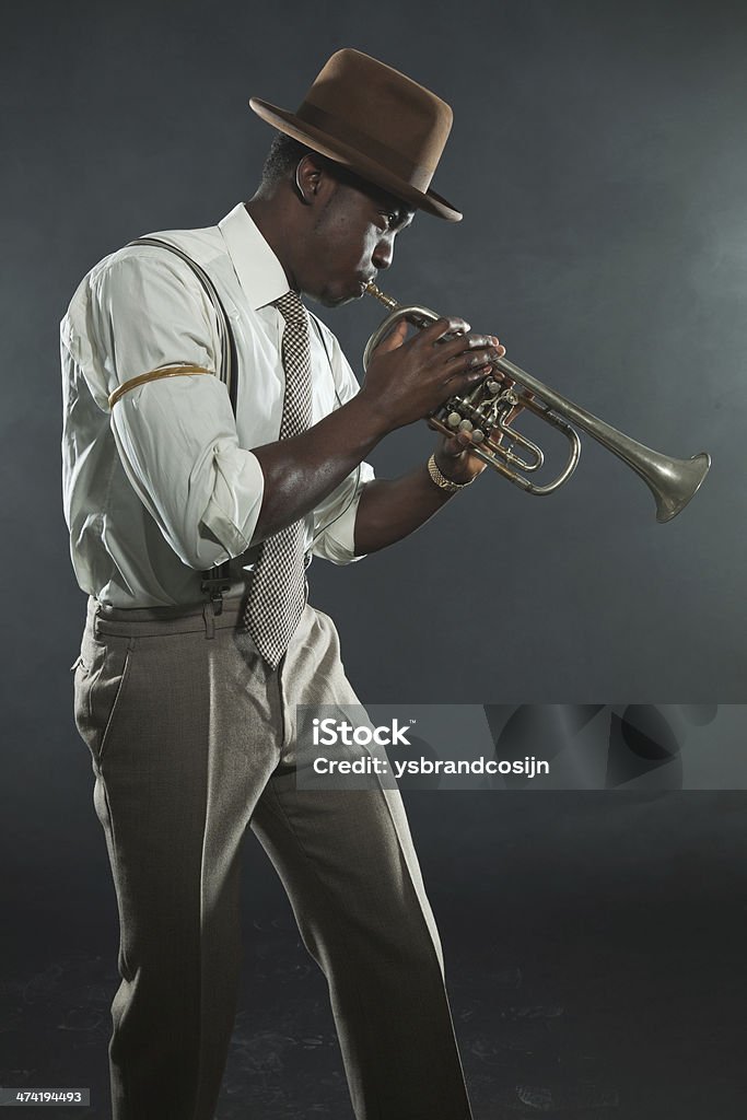 Black african american jazz trumpet player. Vintage. Studio shot. Jazz Music Stock Photo