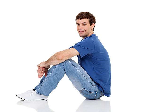 istock side view of man sitting on the floor 474194699