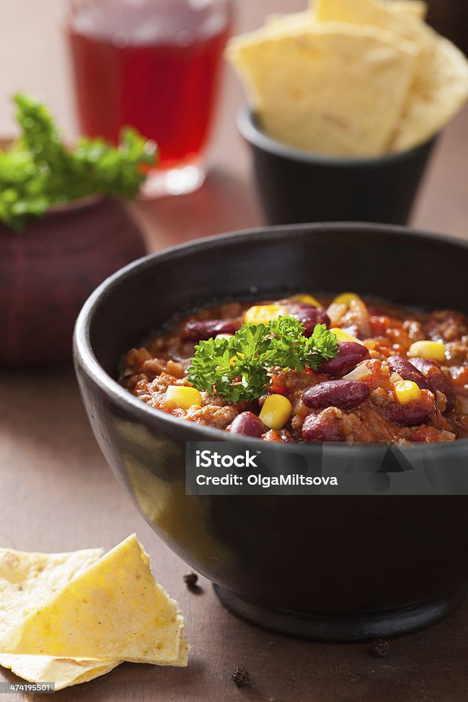 mexican chili con carne in black plate with tortilla Beef Stock Photo