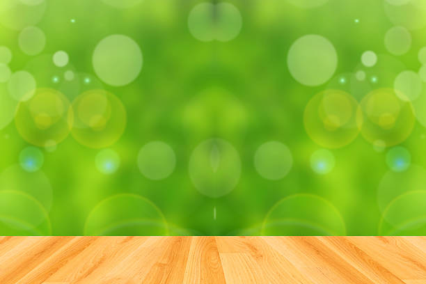 istock wood floor and abstract green bokeh background 474196086