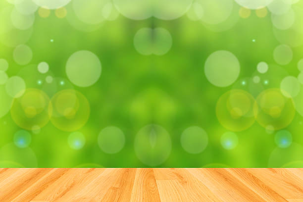 istock wood floor and abstract green bokeh background 474196088