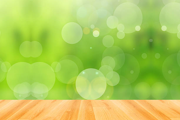 istock wood floor and abstract green bokeh background 474196100