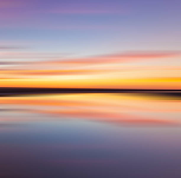 istock Colorful sunset with long exposure effect, motion blurred 474196349