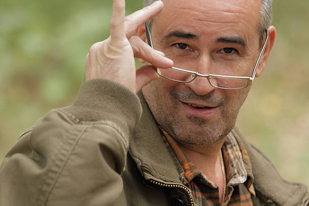 istock Mature man with glasses scratched 474199776