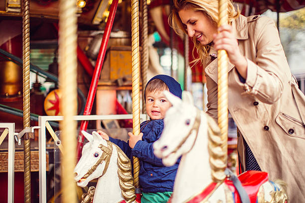 istock Mommy and me on a carousel ride 474203410