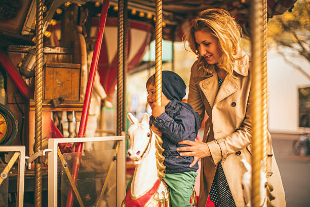 istock Mommy and me on a carousel ride 474203420