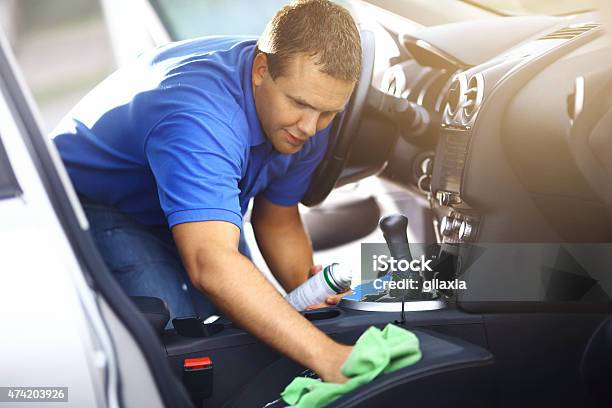 Man Cleaning Upholstery Of His Vehicle Stock Photo - Download Image Now - Car, Car Wash, Cleaning