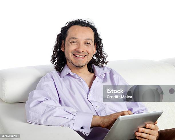 Smiling Man With Tablet In Home Stock Photo - Download Image Now - 2015, 30-39 Years, 40-44 Years