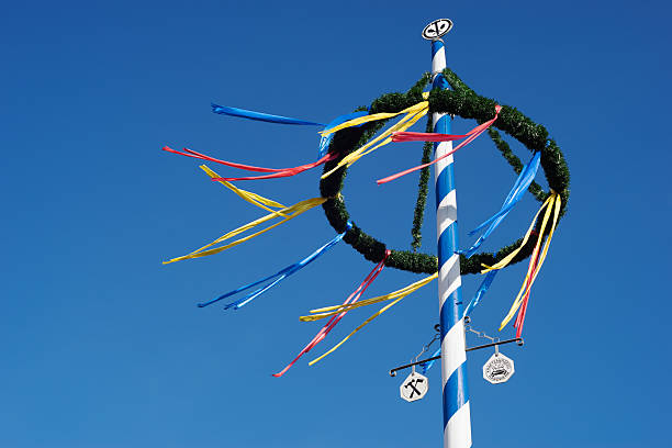 bavarian maypole against blue sky maypole, ribbon, German Cultures, 1st of may, beer garden, Bavaria whitsun stock pictures, royalty-free photos & images