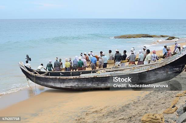 Fishermen Are Pulling The Net From The Sea In India Stock Photo - Download Image Now