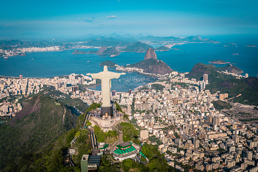 Rio De Janeiro, Brazil - February 11, 2015: Rio de Janeiro, Brazil : Aerial view of Christ and Botafogo Bay from high angle. Statue is located on Corcovado Hill and is facing the city and Guanabara Bay.