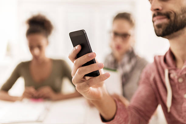 istock Close up of a man using mobile phone. 474210666