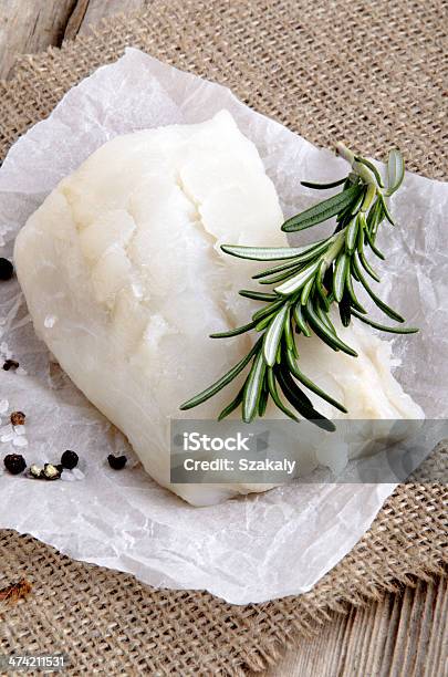 Cod Filled With Rosemary On Kitchen Paper Stock Photo - Download Image Now - Brown, Canvas Fabric, Cod