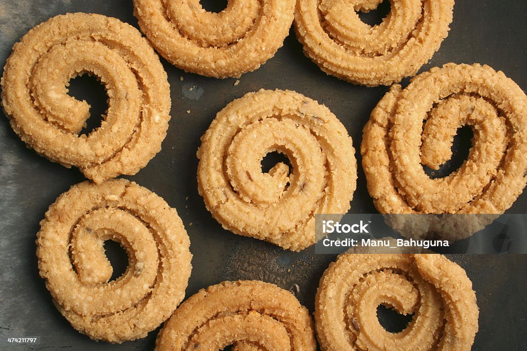 Chakli è un famoso spuntino festa indiana - Foto stock royalty-free di Cibi e bevande